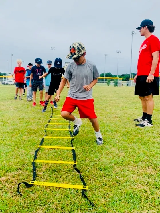 A player working through an agility ladder